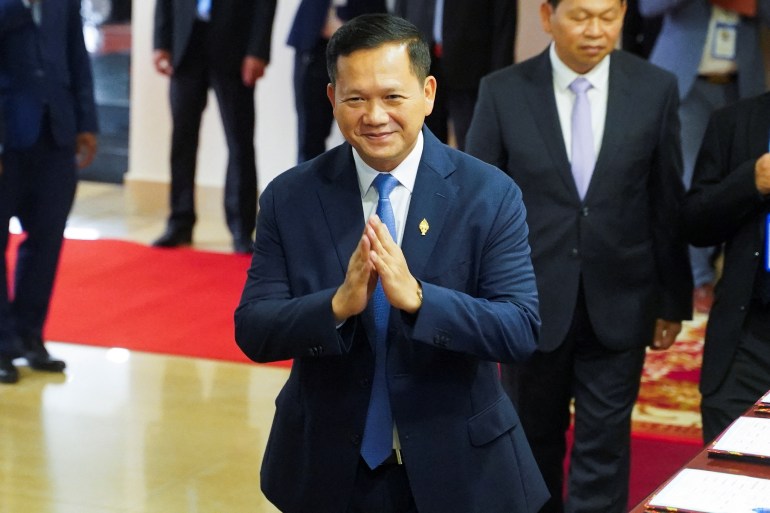 Hun Manet, nominee for Cambodia's prime minister, gestures as he registers at the National Assembly on the day that parliament votes to confirm the country's next prime minister, in Phnom Penh, Cambodia, August 22, 2023. REUTERS/Cindy Liu