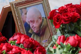 A framed photo of Russian mercenary chief Yevgeny Prigozhin is seen at his grave at the Porokhovskoye cemetery outside St Petersburg on August 30, 2023 [Reuters]