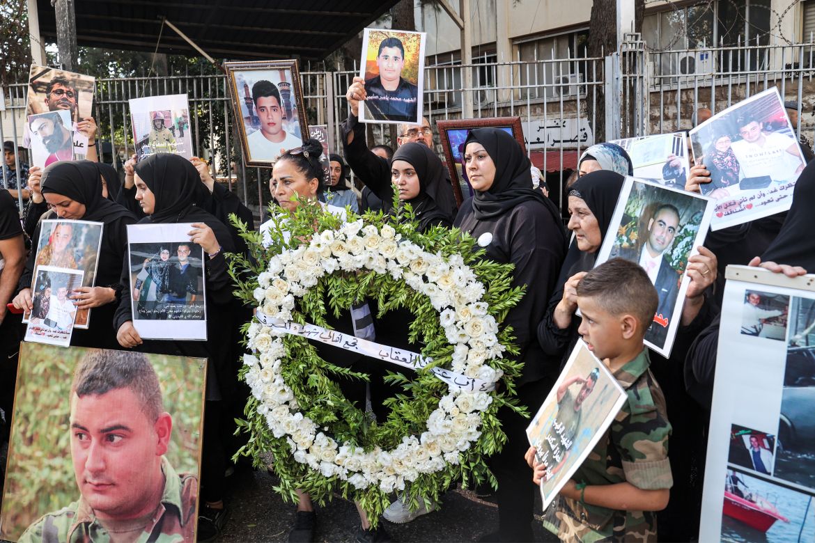 Families of the victims of the 2020 Beirut Port blast demonstrate with their portraits outside the Justice Palace