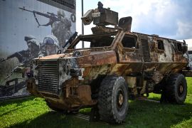 This photograph taken on August 15, 2023 shows a burnt Australian Bushmaster Protected Mobility Vehicle displayed at the exposition field in Kubinka Patriot Park, outside Moscow during the International Military Forum Army - 2023. - Russian defence minister Sergei Shoigu said on August 15, 2023 that Ukraine's military resources were "almost exhausted", as Kyiv wages a gruelling counter offensive to recapture lost territory. (Photo by Alexander NEMENOV / AFP)