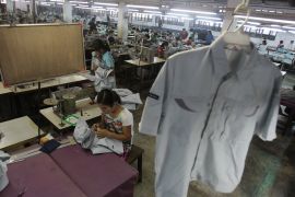 In this photo taken Saturday, April 21, 2012, a young worker sews a shirt at a garment factory in Yangon, Myanmar.