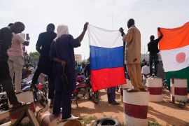 Nigeriens holding a Russian flag