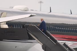 Former President Donald Trump boards his plane at Newark