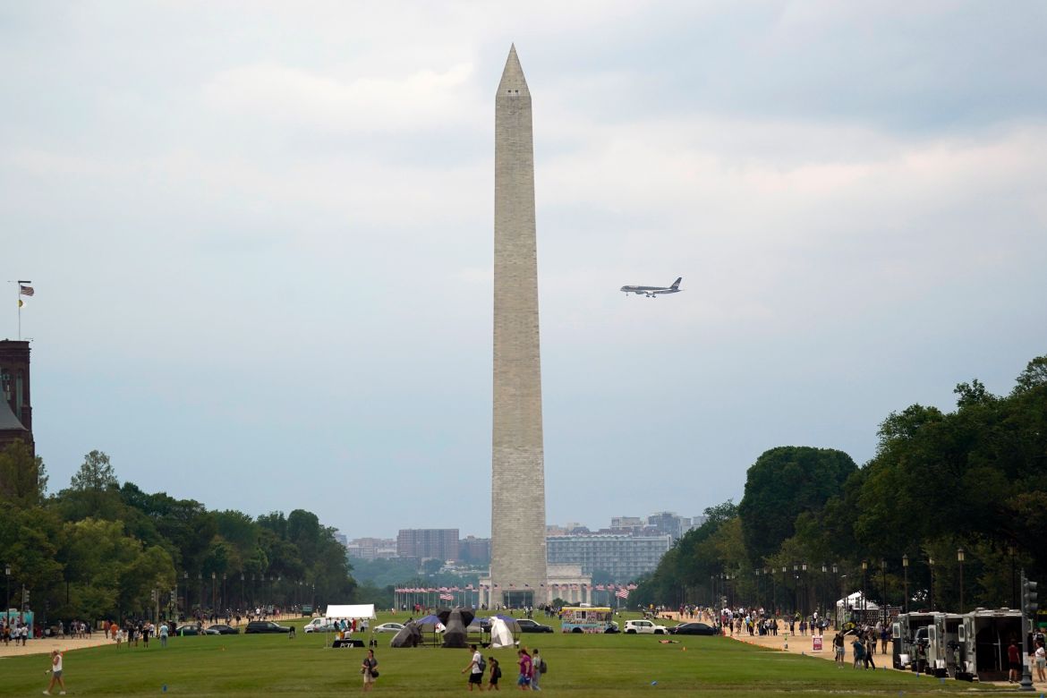 Former President Donald Trump's airplane flies behind the Washington Monument