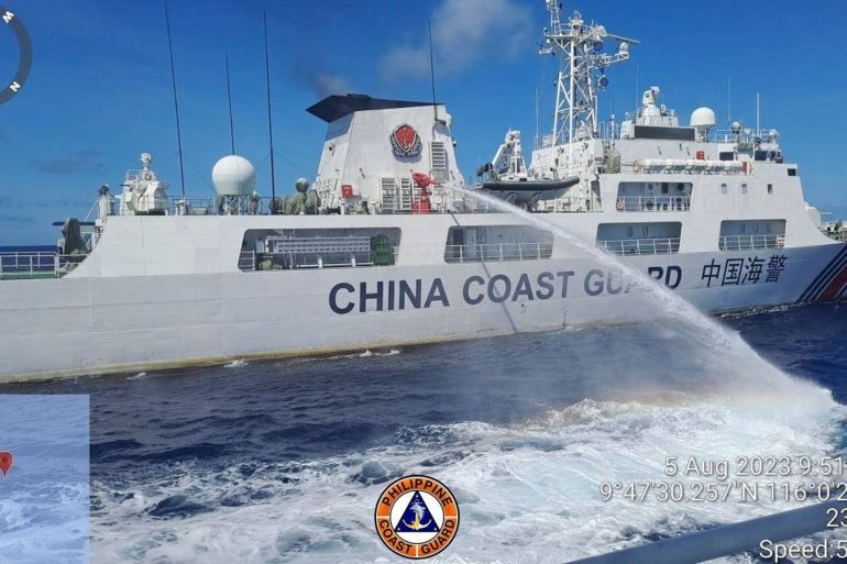In this handout photo provided by the Philippine Coast Guard, a Chinese coast guard ship uses a water cannon on a Philippine Coast Guard ship