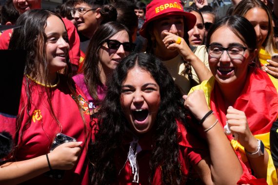 Spanish fans celebrate in a street, in Madrid, Spain, Sunday, Aug. 20, 2023, after Spain won against England in the Women's World Cup final soccer match played in Australia.