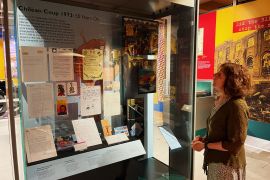 Gloria Miqueles gazes at the window display at the Postal Museum in London detailing 1973 coup in Chile