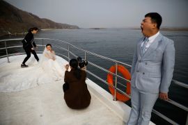 A couple have their wedding photos taken in China&#39;s Liaoning province in 2017 [File: Damir Sagolj/Reuters]