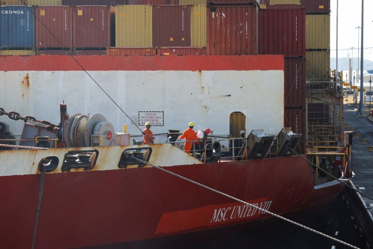 Mariners are seen at the Liberian MSC UNITED VIII container ship during its transit in the expanded canal through Cocoli Locks at the Panama Canal, on the outskirts of Panama City, Panama