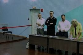 Defendant Alexey Navalny took part by video link wearing a black prison uniform [Evgenia Novozhenina/Reuters]