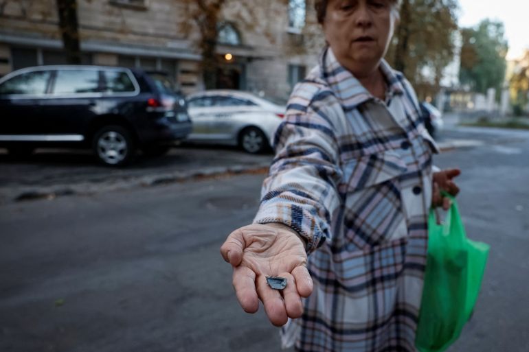 A local resident Lyudmila, 65, shows the splinter that hit her apartment during a Russian drone strike, amid Russia's attack on Ukraine, in Kyiv, Ukraine September 10, 2023. REUTERS/Gleb Garanich