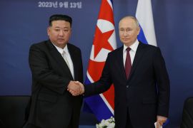 Russia's President Vladimir Putin shakes hands with North Korea's leader Kim Jong Un during a meeting at the Vostochny Сosmodrome in the far eastern Amur region, Russia