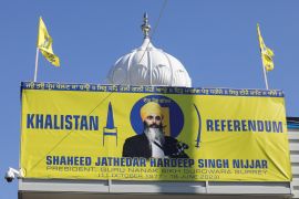 A banner with the image of Sikh leader Hardeep Singh Nijjar at the Guru Nanak Sikh Gurdwara temple where he was killed in June, in Surrey, British Columbia, September 20, 2023 [File: Chris Helgren/Reuters]