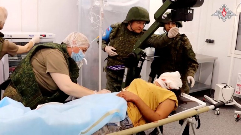 An injured civilian receives medical treatment from Russian peacekeepers at an unknown location following the launch of a military operation by Azerbaijani forces in Nagorno-Karabakh, a region inhabited by ethnic Armenians, in this still image from video published September 20, 2023. Russian Defence Ministry/Handout via REUTERS ATTENTION EDITORS - THIS IMAGE WAS PROVIDED BY A THIRD PARTY. NO RESALES. NO ARCHIVES. MANDATORY CREDIT. WATERMARK FROM SOURCE.