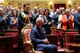 French senators and members of the National Assembly greet King Charles in the French Senate [Emmanuel Dunand/Pool via Reuters]