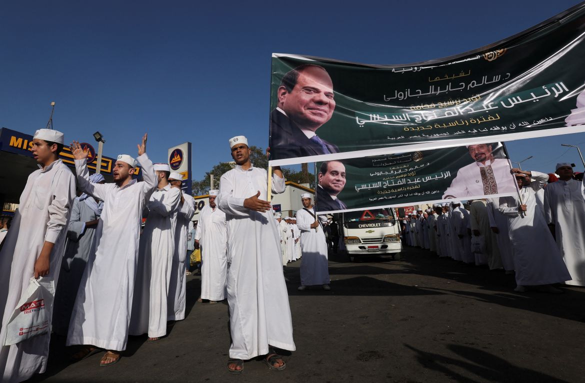 Sufi Muslims carry banners in support of Egypt's President Abdel Fattah al-Sisi for the incoming presidential election, during the celebration of "Mawlid al-Nabawi", or the birth of Prophet Mohammad, in Al Azhar district, Old Cairo, Egypt, September 27, 2023. REUTERS/Amr Abdallah Dalsh