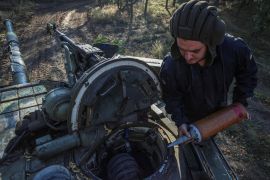 A Ukrainian serviceman loads shells into a tank in the eastern Donetsk region [Oleksandr Ratushniak/Reuters]