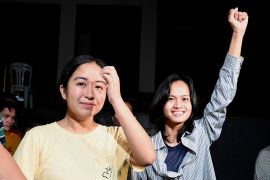 Jhed Tamano and Jonila Castro after their release. Jhed is on the left and Jonila is on the right holding her arm aloft