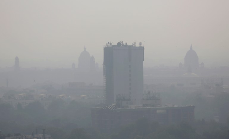 In this photo taken Friday, Oct. 28, 2016, a layer of smog envelops the city skyline before Diwali festival in New Delhi, India. As north Indian cities enter the season of high air pollution, a new report is warning about the dangers to children. (AP Photo/Altaf Qadri)