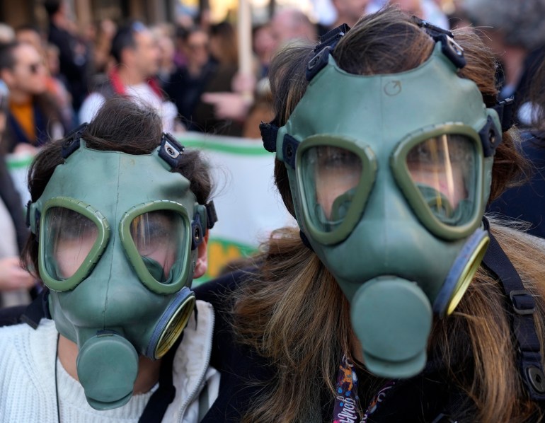 People attend a protest against pollution and for a cleaner air in Belgrade, Serbia, Sunday, Nov. 13, 2022. Protesters urge the Serbian government to change its attitude towards environmental issues. (AP Photo/Darko Vojinovic)