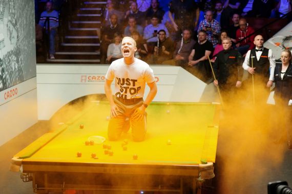 A Just Stop Oil protester disrupts a match at the World Snooker Championship