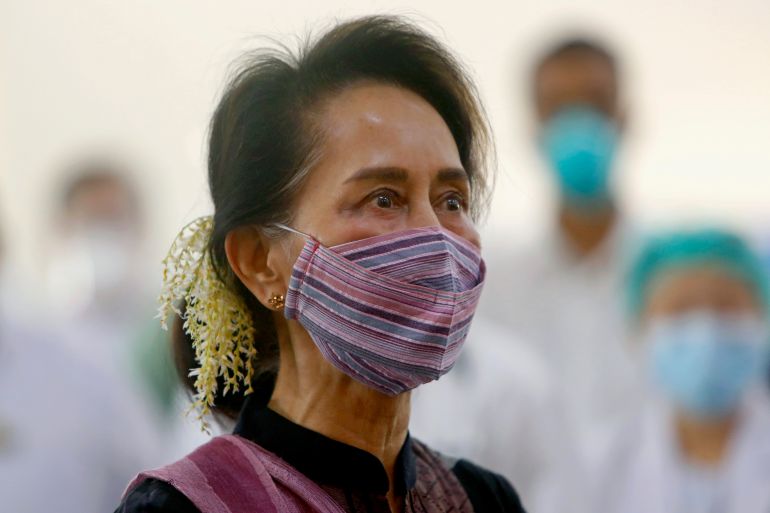 FILE - Then Myanmar leader Aung San Suu Kyi watches the vaccination of health workers at a hospital in Naypyitaw, Myanmar on Jan. 27, 2021. Myanmar’s imprisoned former leader, Aung San Suu Kyi, is suffering from symptoms of low blood pressure including dizziness and loss of appetite, but has been denied treatment at qualified facilities outside the prison system, a medical worker said Thursday Sept. 7, 2023. (AP Photo/Aung Shine Oo, File)