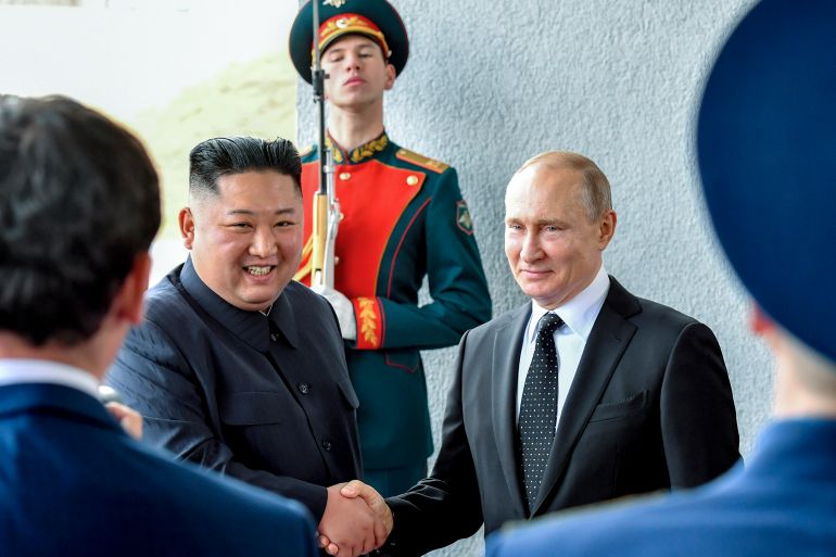 Russian President Vladimir Putin, center right, and North Korea's leader Kim Jong Un shake hands during their meeting in Vladivostok, Russia, Thursday, April 25, 2019.