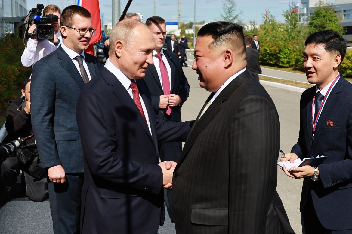 Russian President Vladimir Putin, left, and North Korea's leader Kim Jong Un shake hands during their meeting at the Vostochny cosmodrome outside the city of Tsiolkovsky,