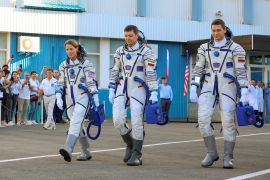 In this photo released by Roscosmos space corporation, from left, NASA astronaut Loral O'Hara, Roscosmos cosmonauts Oleg Kononenko and Nikolai Chub, crew members of the new mission to the International Space Station, ISS, walk prior the launch of Soyuz MS-24 space ship in Russian leased Baikonur cosmodrome, Kazakhstan, Friday, Sept. 15, 2023. (Roscosmos space corporation, via AP)