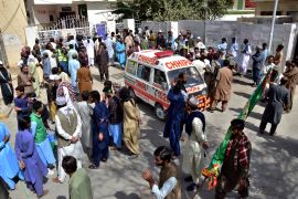 People gather at a hospital in Quetta where the victims are being treated [Arshad Butt/AP Photo]