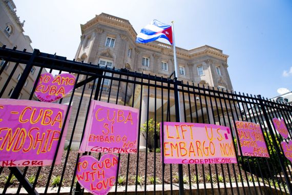 The Cuban flag over their new embassy in Washington, Monday, July 20, 2015. The United States and Cuba restored full diplomatic relations Monday after more than five decades of frosty relations rooted in the Cold War. (AP Photo/Andrew Harnik)