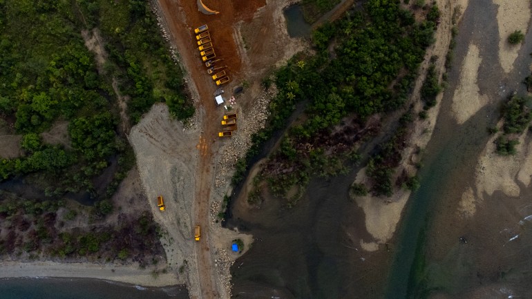 A drone image of the mining site near Mount Guiting-Guiting in the island of Sibuyan. The earth is exposed in a brown tear through the lush green landscape.