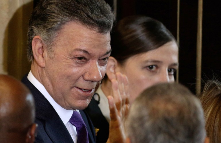 A close-up of former President Juan Manuel Santos, in a suit and tie at a government event.
