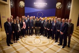 Ukraine&#39;s President Volodymyr Zelenskyy and EU foreign ministers pose for a picture during a EU-Ukraine foreign ministers meeting, in Kyiv, Ukraine [Ukrainian Presidential Press Service/Handout via Reuters]