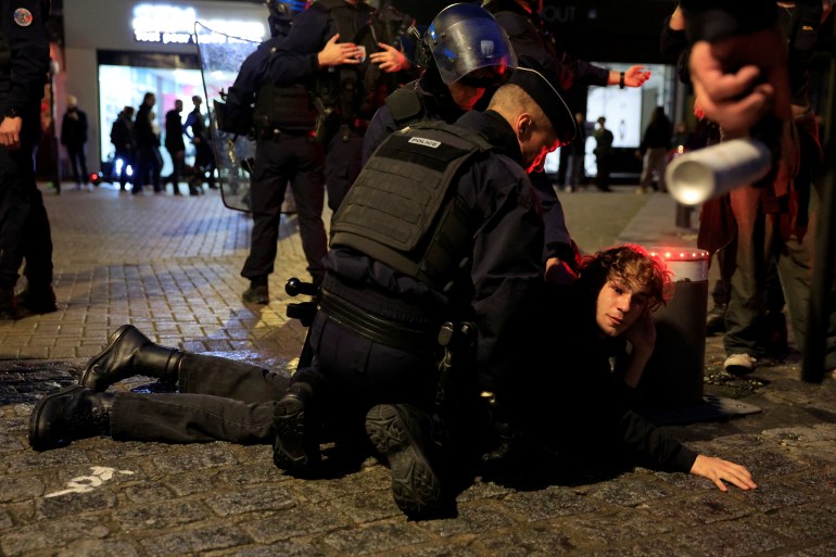 French police detain a pro-Palestinian protestor 