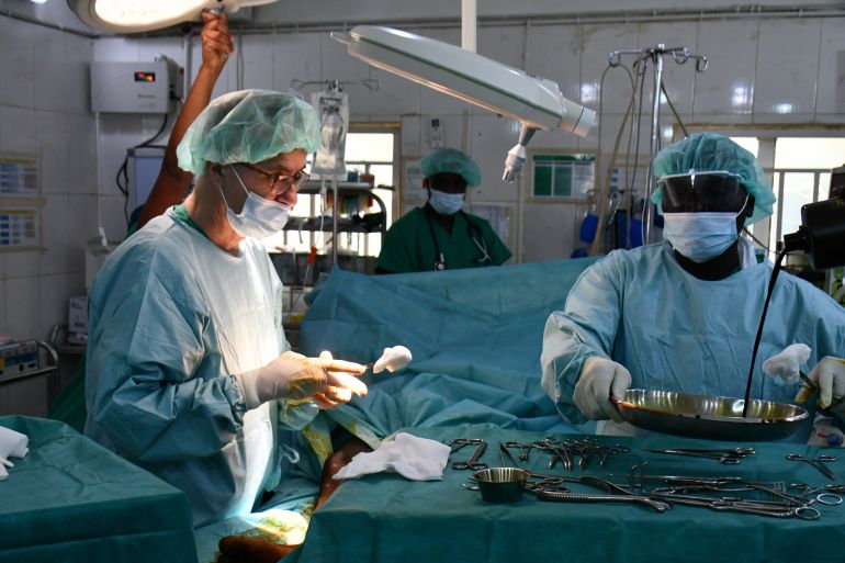 A surgeon is seen at work on a patient with a bullet wound at the main hospital in Maiduguri, northeast Nigeria