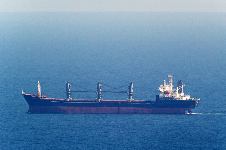 In this photograph taken on September 16, 2023, the "Aroyat" bulk carrier ship registered in Palau, sails towards the Ukrainian Black sea port of Chornomorsk, using a temporary corridor set up by Kyiv to ensure safe navigation through the Black Sea, amid the Russian invasion of Ukraine. (Photo by STRINGER / AFP)