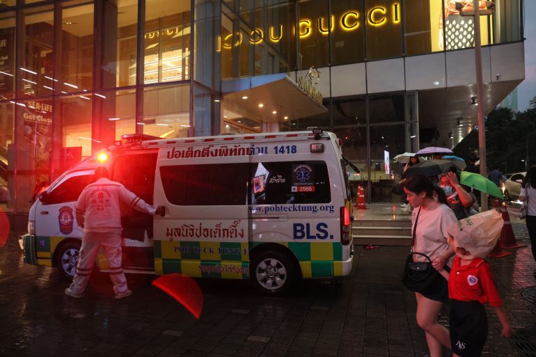 An ambulance is seen outside Siam Paragon shopping centre in Bangkok