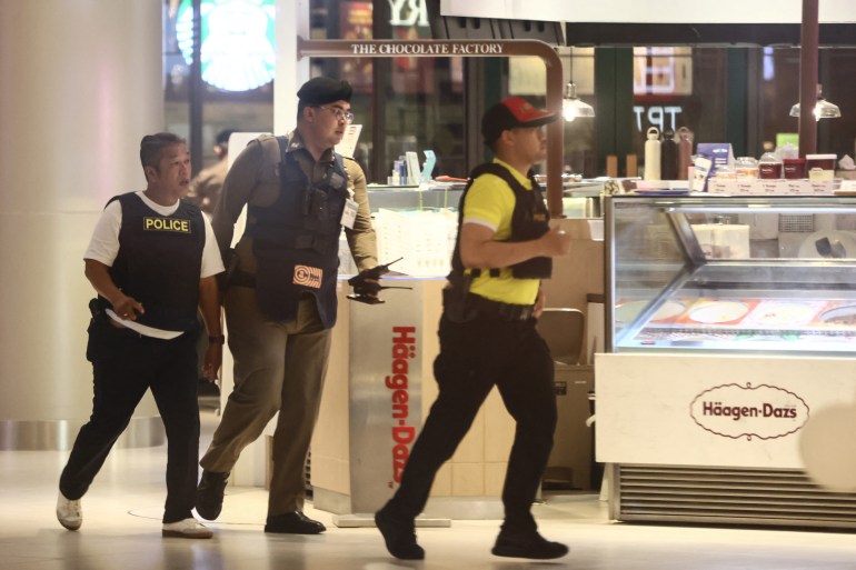 Thai police officers secure Siam Paragon shopping centre