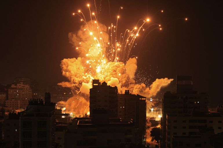 Orange flame and smoke in Gaza City during an Israeli missile attack