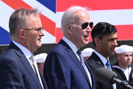 UK Prime Minister Rishi Sunak (right), US President Joe Biden (centre) and Australian Prime Minister Anthony Albanese (left), announce details of the AUKUS trilateral pact in March [File: Leon Neal/Pool via AP]