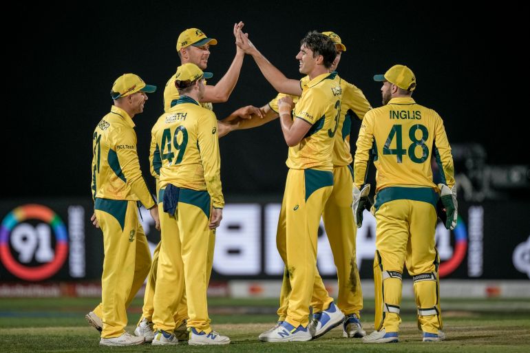 Australian players celebrate the dismissal of New Zealand's Matt Henry