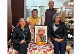Kanchan Arora's children (clockwise from left) Sunandini, Vineet, Vivek and Mandakini with their mother's photograph