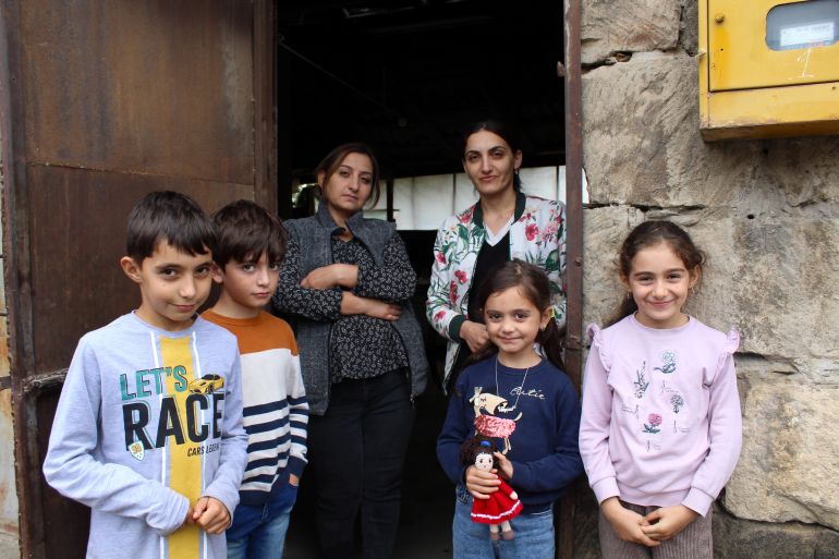 Sisters Lira Arzangulyan and Alina Khachatryan with their children outside the house they are staying in after fleeing their home in Stepanakert, Nagorno-Karabakh-1696579835