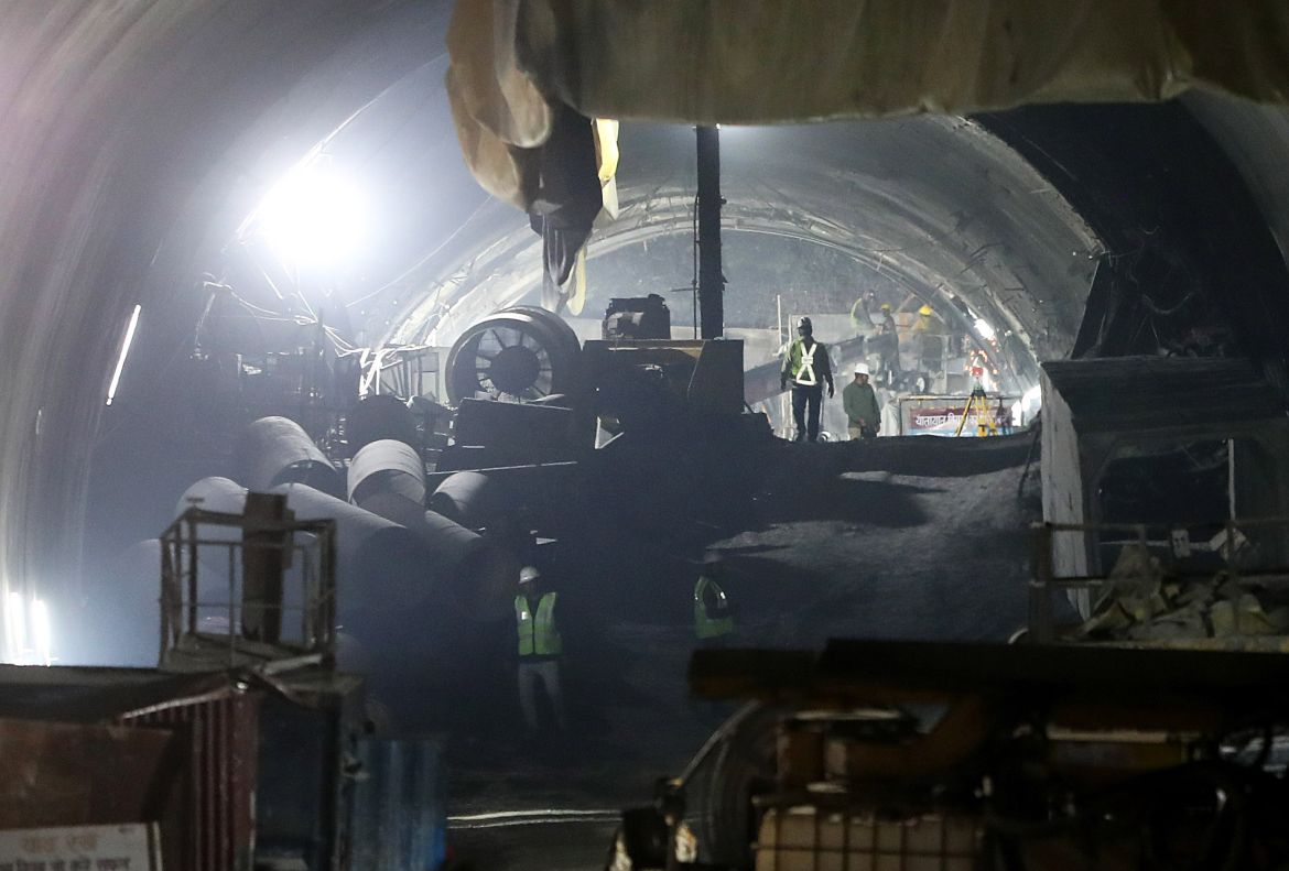 Heavy machinery, rescue workers and experts gather inside the tunnel