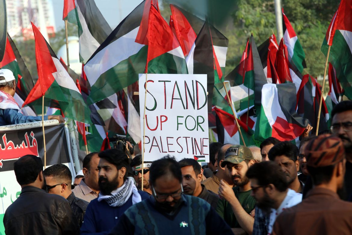 People hold Palestinian flags during a demonstration in solidarity with the Palestinian people, in Karachi, Pakistan.