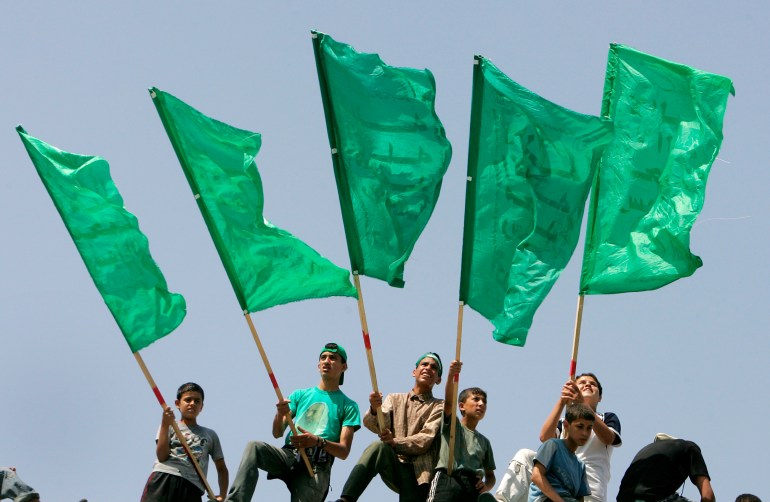 Palestinians wave Hamas flags during a celebration rally in Gaza June 15, 2007