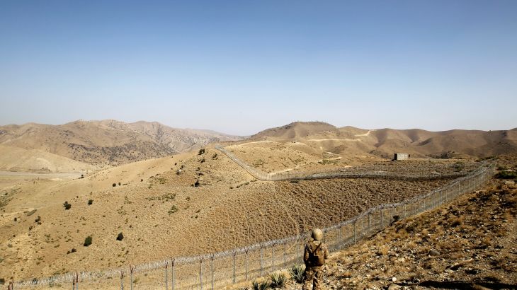 A soldier stands guard along the border fence outside the Kitton outpost on the border with Afghanistan in North Waziristan, Pakistan October 18, 2017. REUTERS/Caren Firouz