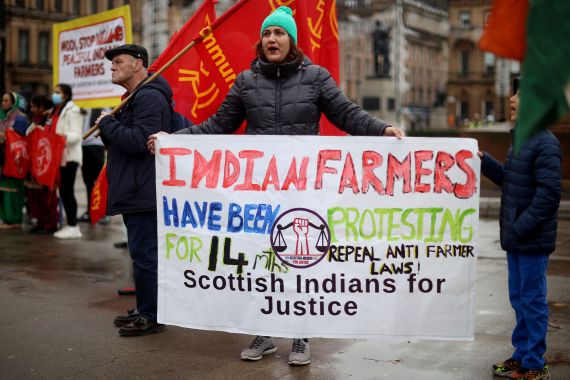 Demonstrators hold placards during a protest against the visit of India's Prime Minister Narendra Modi to the UN Climate Change Conference (COP26) in Glasgow, Scotland, Britain, October 31, 2021.