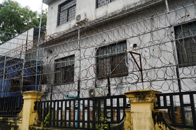 High fences topped with barbed wire around a suspected cyberscam compound in Sihanoukville